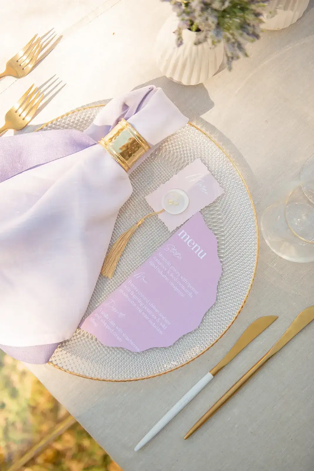 A lilac menu and gold cutlery, spring styled shoot