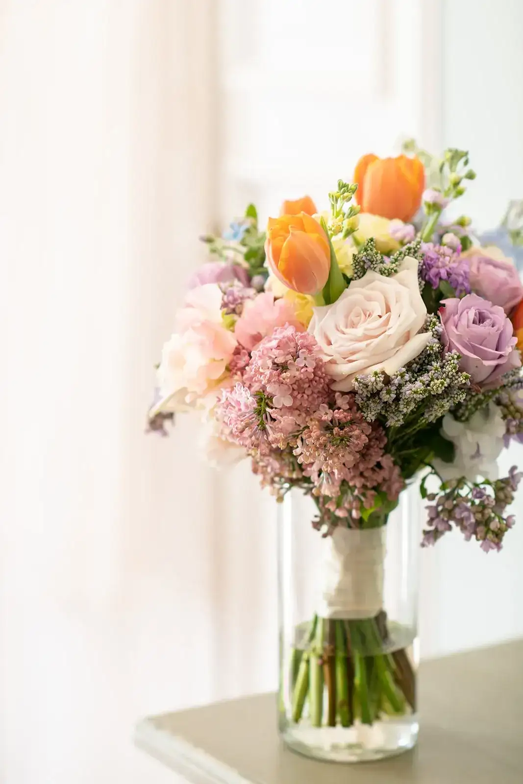 Peach tulips and garden roses, spring styled shoot