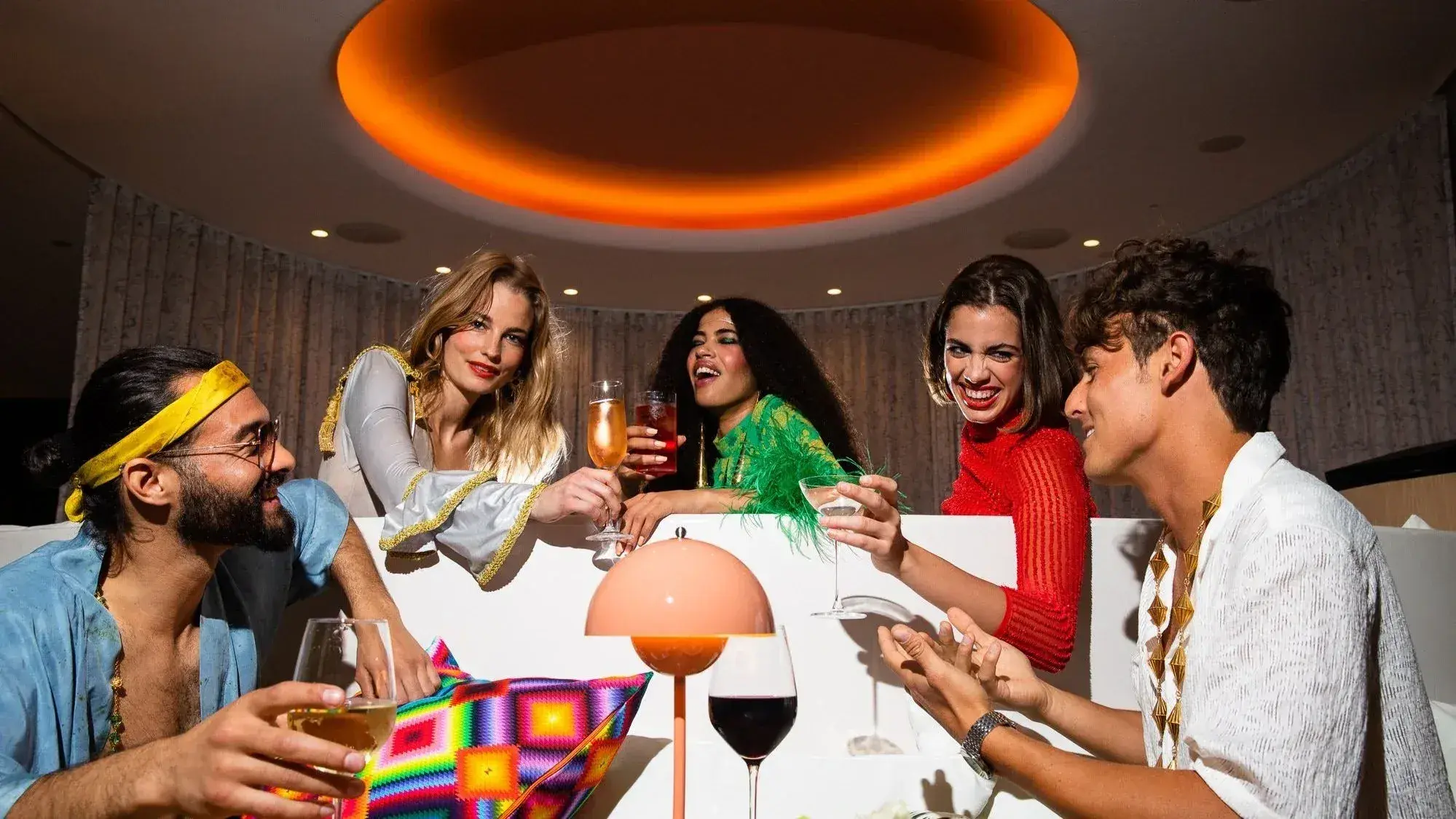 The Standard Ibiza: Guests drinking and laughing at a table during an evening event